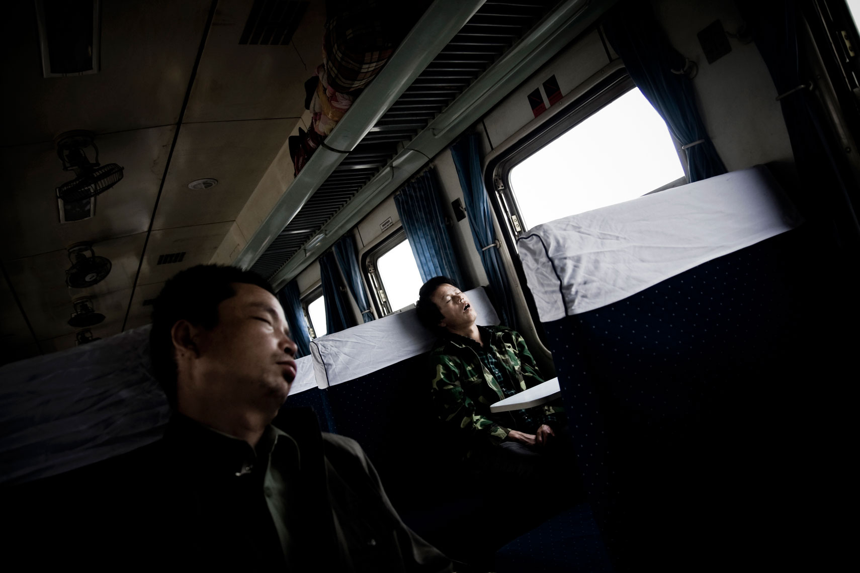 CHINA. Shanxi Province, September 2012. Passengers sleeping on the train that connects the cities of Datong and Ping Yao.